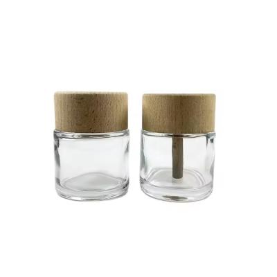 中国 50ml Clear Glass Diffuser Bottles with Wooden Cap Perfume Luxpry Glass Bottles 販売のため