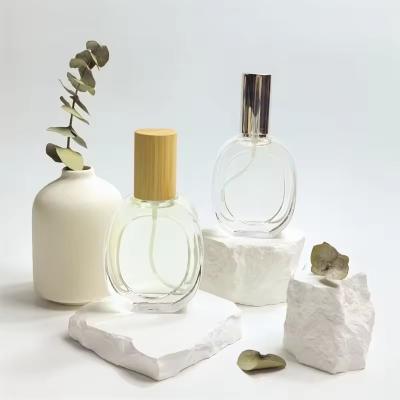 中国 Glass Perfume Bottling Oblate Round Transparent Bottle Portable Spray Bottle 販売のため