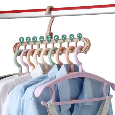 China Multi-port Plastic Rack Hangers 9 Holes Eco-friendly Material 360 Rotating Folding Clothes Drying Rack for sale