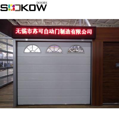 China Single and double track steel track with corner 40mm thickness best heat insulation nylon automatic garage white steel sectional doors for sale