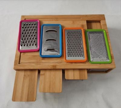 China Sustainable Rectangle Bamboo Cutting Board Bamboo Chopper With Graters And Containers for sale