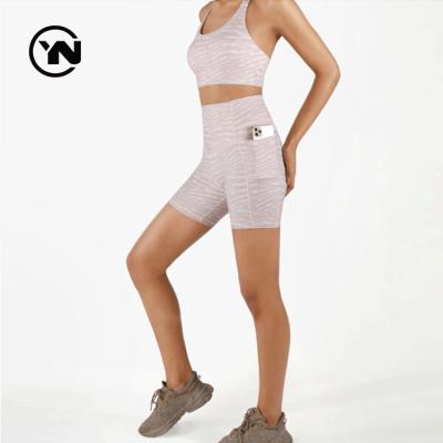 China OEM Logo Seamless Fabric Women Yoga Biker Shorts Anti-Wrinkle Women's High Waisted Nylon Sports Shorts With Pockets for sale