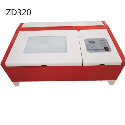 China 2030 Desktop Laser Cutter Engraving Machine Rubber Stamp Laser Engraver 40W Mini Laser Cutting Machine 200*300 For Seals Small Opens for sale