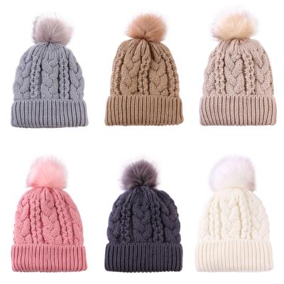 China COMMON Wholesale Custom Fleece Winter Hats Women Knit Beanie With Pom Pom for sale