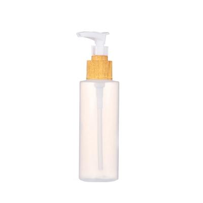 China Non Spill Hot Sales 100ML PET Bottle With Wooden Lotion Pump For Packaging for sale