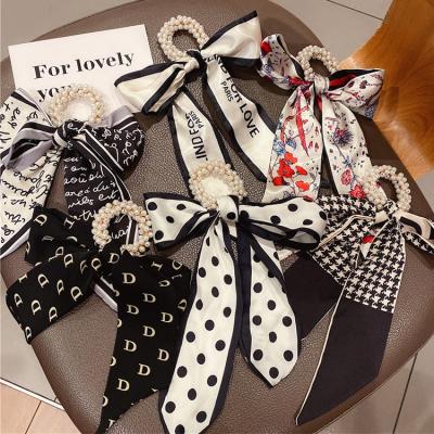 China Popular Fashion Printed Satin Bow Elastic Hair Band Tie Rope Hair Scrunchies Women Hair Scrunchies Elastic Silk Hair Ties for sale