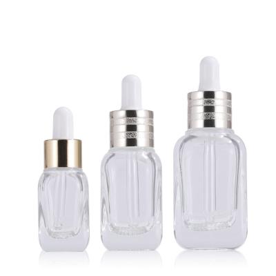 China Personal Care 100pcs/lot 15 Dropper 20 40ml Portable Clear Glass Bottle Travel Face Essence Bottles Square Grid Bottle for sale