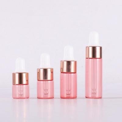 China Personal Care 1ml 2ml 3ml 5ml Pink Dropper Bottle With Logo Refillable Perfume Bottles Custom Rose Gold Ring Essential Oil Glass Bottles for sale