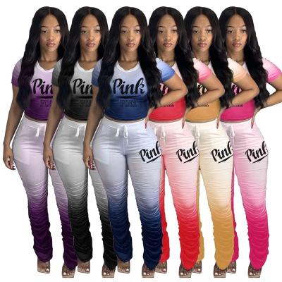 China anti-wrinkle 2022 spring summer plus size pink 2 piece set casual gradient t-shirt tracksuit pleated tracksuit pants pants two piece set for sale