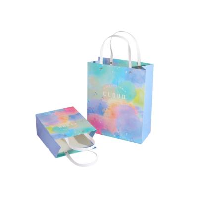 China Recycled Materials OEM Paper Bags With Your Own Logo Custom Printed Colorful Shopping Bags for sale