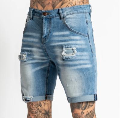 China Hot selling viable seller jeans fashionable ripped flanging half tepered pants tapered denim shorts men denim for sale