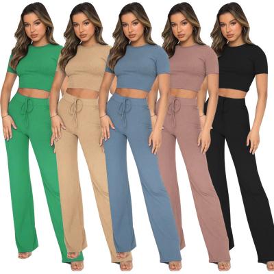 China New Fashion Hot QUICK DRY Casual Set Women's Solid Color High-elastic Body Shaping Short Sleeve Stripe Wide Leg Pants Two Piece Set for sale