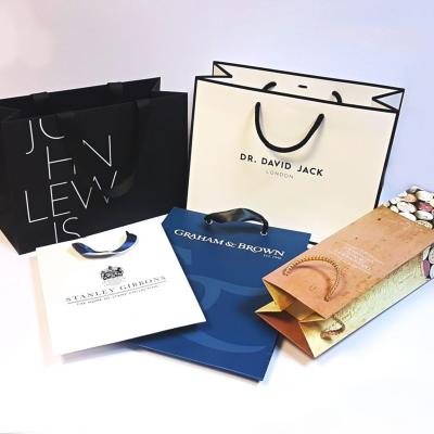 China Recycled Materials Gift Bags Wholesales Luxury Paper Bags For Small Business Gift Shopping Shoes Clothing Packaging Bags With Handle for sale