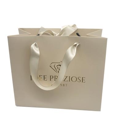 China Luxury Recycled Materials Ribbon Handle Boutique Shopping Packaging Customized Printed Euro Italy Paper Gift Bags With Logo for sale