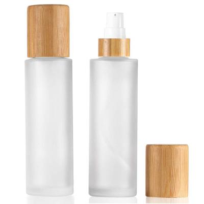 China 100ml Frosted Glass Cosmetic Empty Lotion Bottle With Bamboo Lid Travel Spray Bottles Pump Dispenser For Cosmetic Packaging for sale