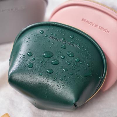 China Portable Travel Mini Make Up Bag Unicorn Quilted Stylish Logo Small Lip Makeup Small Travel PU Cosmetic Case Waterproof Leather White Makeup Bag for sale