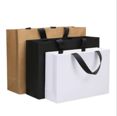 China Recycled Materials Custom White Paper Eco Friendly Shirt Clothing Tote Bags With Logo for sale