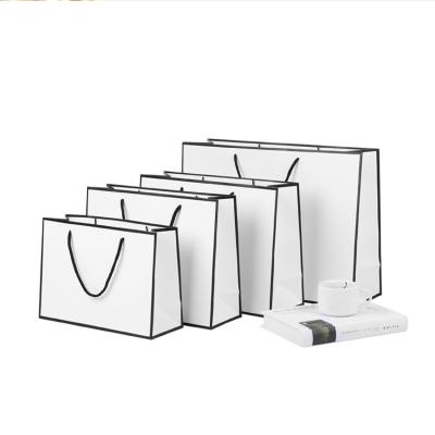 China Eco Friendly Wholesale Biodegradable Customized Own Logo White Shopping Paper Bag With Handles for sale