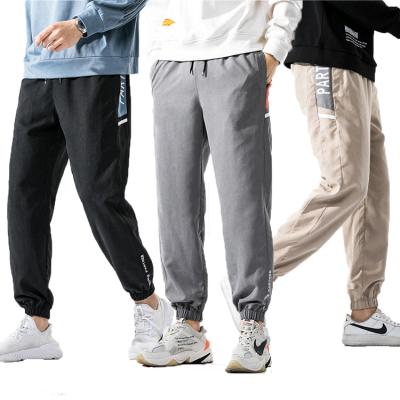 China Anti-pilling Mens 100% Polyester Mens Hombre Khaki Black Gray Track Pants Work Kerosene Trousers Plus Size Cargo Pants for sale