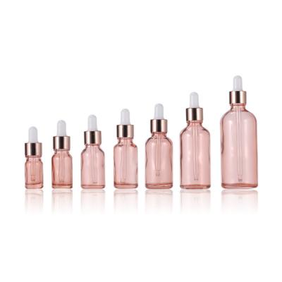 China New Product 5ml 10ml 15ml 20ml 30ml 50ml 100ml Recyclable Luxury Pink Glass Bottle Eco-friendly Rose Gold Essential Oil Bottles Hair Oil Dropper Bottles for sale