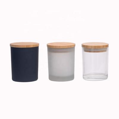 China Decorative skin care cream luxury fancy design custom logo forsted candle glass jar with wooden lid for sale