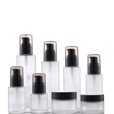 China Eco-friendly Recyclable Empty Natural Skincare Product Packaging Cosmetic Bottle Glass Set Press Bottle And Jar for sale