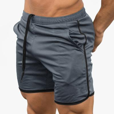 China Anti-wrinkle Summer Sports Wear Men's Mesh Shorts Gym Workout Training Sports Underpants With Pockets for sale