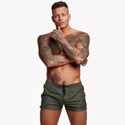 China Trend Fashion Breathable Sports Shorts Fitness Running Quick-drying Slim Three-point Pants Three Inch Zipper Men Beach Shorts for sale