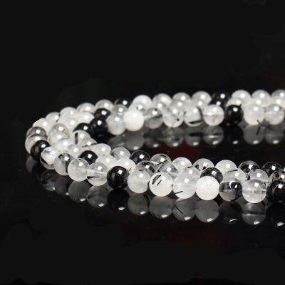 China Polished Natural Spiritual Healing Stone Gemstone Polished Smooth Loose Round Black Rutilated Quartz Beads For Jewelry Making for sale