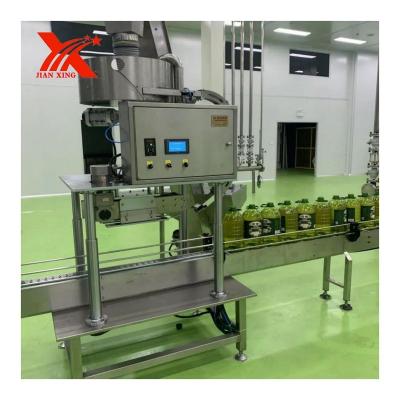 China Guangdong Food Lid Lift Capping Machine Crawler Type Capping Machine for sale