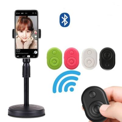 China Hot Selling ABS Wireless Shutter Phone Selfie Timer Camera Controller Mini Photo Remote Control For Universal Phone for sale