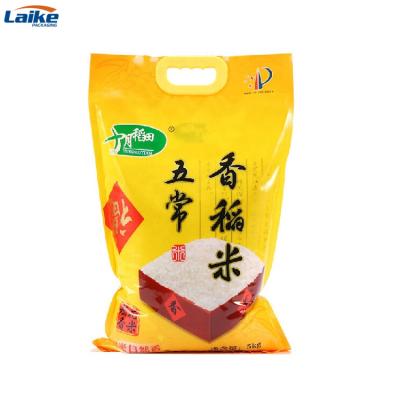 China China Wholesale Moisture Proof Design Customized Gavure Printing Rice Bag Size 1kg 5kg 10kg With Plastic Handle for sale