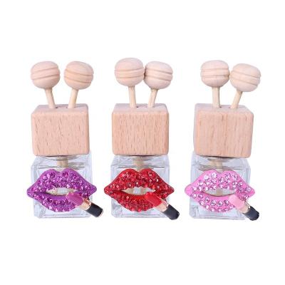 China New Cute Squareglass Car Perfume Bottle Lips Vent Clip Perfume Bottles Red Wooden Stick Daily Necessities for sale