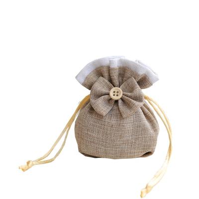 China Cute Reusable Canvas Cloth Empty Jewelry Pouch Cotton Drawstring Gift Bag Bowknot Bag For Gift Package for sale