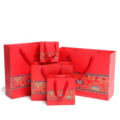 China Recyclable Luxury Red Custom Printed Paper Bag Logo Jewelry Packaging Kraft Shopping Gift Paper Bag With Ribbon Handles for sale