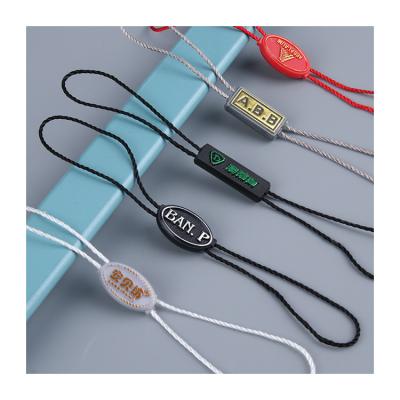 China Other High Quality Custom Own Brand Embossed Logo Plastic String Cord Hang Labels Seal Watch Tag With Nylon String for sale