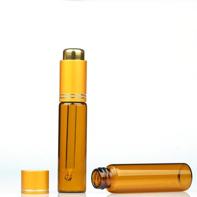 China Manufacturer Huagui Cosmetic packaging 10 ml empty amber essential oil glass perfume roller bottle with golden cap for sale