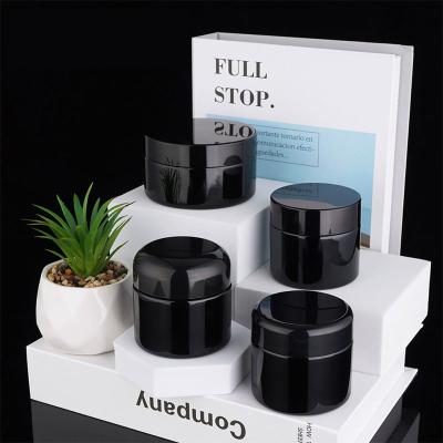 China Skincare de lujo que empaqueta el vidrio negro de 60g 100g alrededor de las tapas poner crema curvadas del ABS de los tarros para la crema de los ojos de la cara en venta