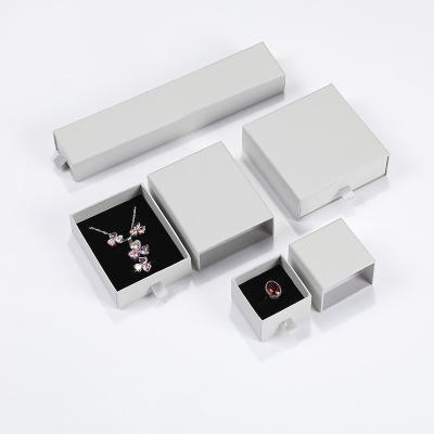 China Hot selling custom logo jewelry box simple gray drawer ring pendant box necklace pearl box jewelry packaging for sale