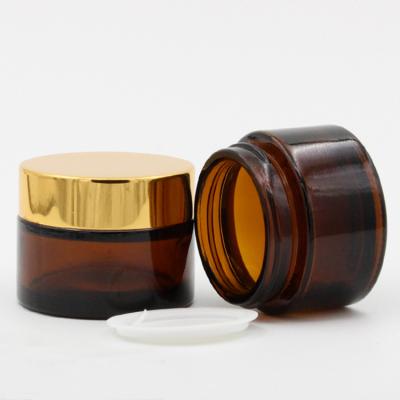 China Personal Care Wholesale Frosted Glass Body Butter Cosmetics 50ml Amber Cream Jar With Lid for sale