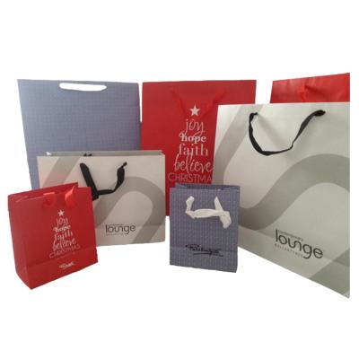 China Recycled Materials Christmas Special Rope Handle Bag Paper Shopping Bag Is Used For Gift Packing for sale