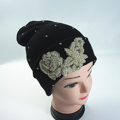 China COMMON Fashion Pearl Winter Earmuff Earmuff Beanie Hat Black Faux Stone Knitted Women's Warm Beanie Hat for sale