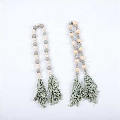 China Nordic Minimalist Style Wood Bead Garland Matched 3 Truss Rustic Natural Wooden Bead String Wall Hanging for sale