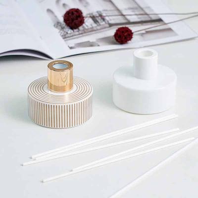 China Pharmaceutical Most Popular Sensation 100ml Perfume Round Golden Caps Glass Aromatherapy Reed Diffuser Bottles for sale