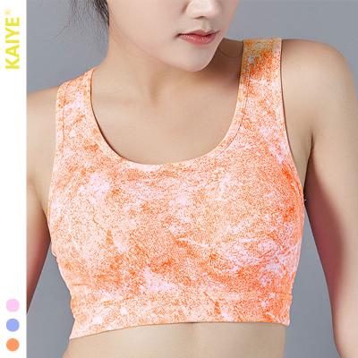 China Breathable New Fashion Custom Seamless Workout Gym Sports Bra Cross-Back Shockproof Moisture Absorptinound Sweat Releasay Ladies Sports Bra for sale