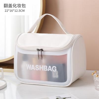 China Durable Travel Toiletry Bag PVC PU Handles Waterproof Transparent Pink Cosmetic Bag Organizer for sale