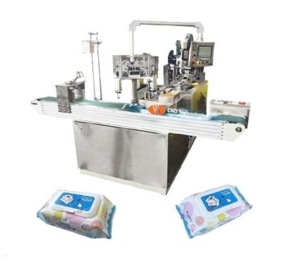 China CND-550N Factory Full Automatic Plastic Lid Applicator Cloth Wet Packing Machine (with and without automatic) for sale