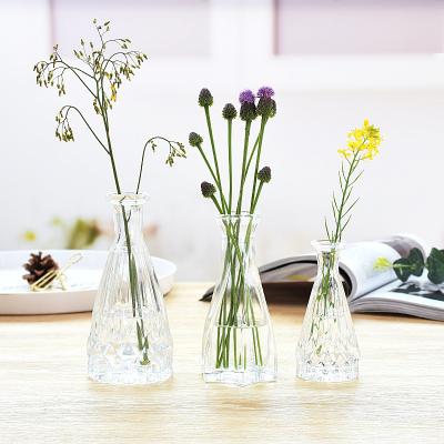 China Mini Creative Clear Glass Bottle Flower Vase Modern High Quality Conical Clear Crystal Glass Vase for Table Top Decor Ornaments for sale