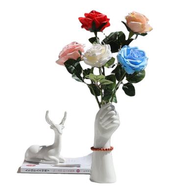 China Traditional Amazon Supplier Handheld Nordic White Vase Flowers Living Room Modern Nordic Ornament Home Decor Pot Office Ceramic Vase for sale