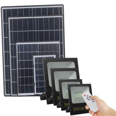 China Light Control + ABS Outdoor Lighting Powerful 100W Good Quality Remote Control Long Lifespan Glass Led Solar Flood Light for sale